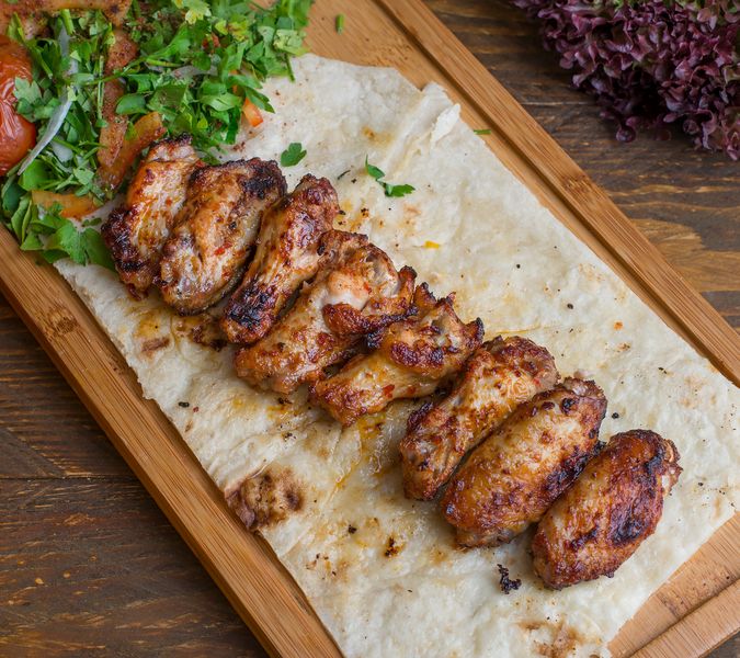 Garlic Parmesan Wings with herb butter coating